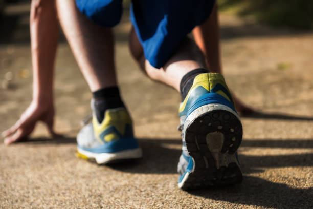 istock running for losing weight at park 891484072