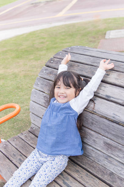 istock Father and girl playing in the park 891484248