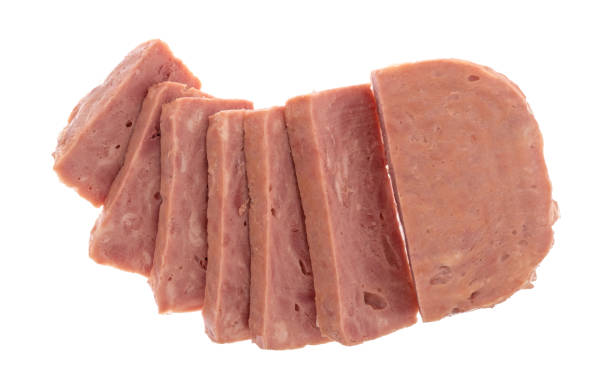 istock Slices of canned ham on a  white background 891492084
