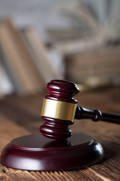 istock Judges gavel, book background. Bokeh. 891498328