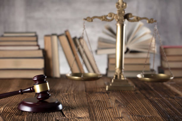 istock Judges gavel, book background. Bokeh. 891498394