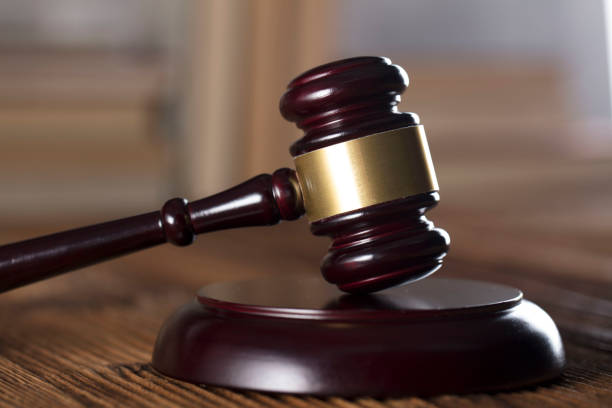 istock Judges gavel, book background. Bokeh. 891500848