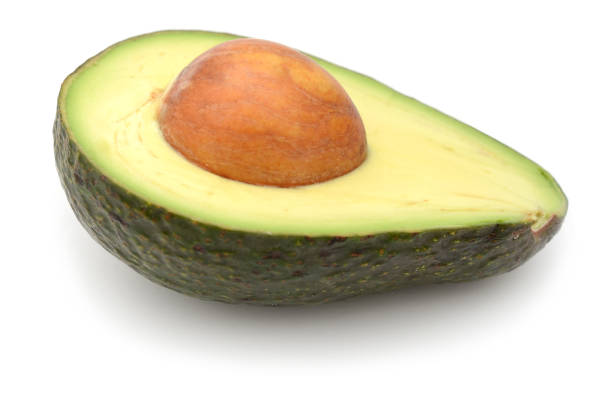 istock Half of avocado fruit isolated on white background 891501072