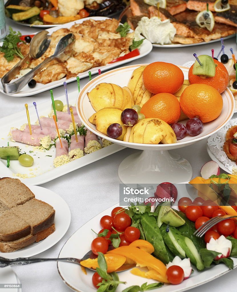 fresh vegetables, fruits and appetizers on served banquet table  Banana Stock Photo