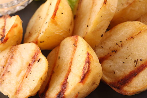 Roasted potato slices stock photo