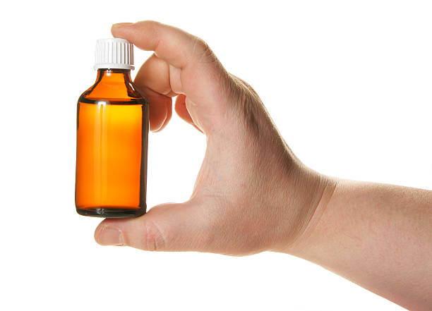 istock Hand holding small bottle with drug 89150960