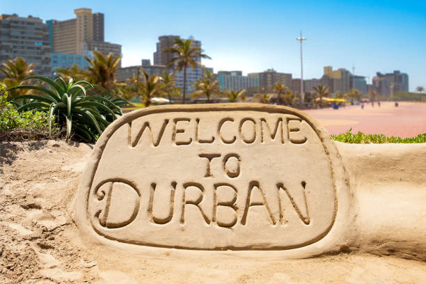Welcome to Durban sand sculpture with skyline of Durban waterside in the background