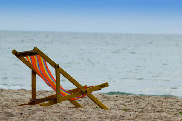 istock beach chair on the beach 891522698