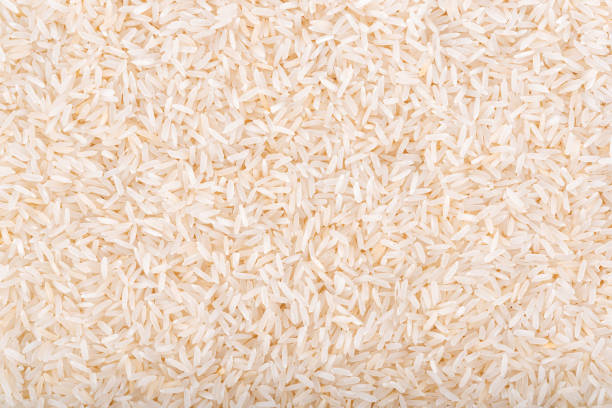 istock Pile of white rice background 891523796