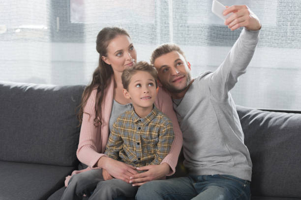 istock Family taking selfie with smarpthone 891527110
