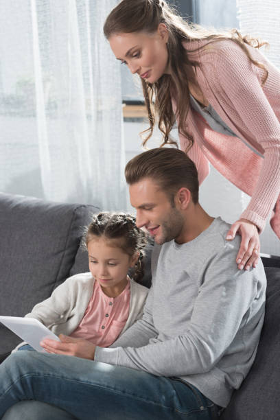 istock Family with child using digital tablet 891527322