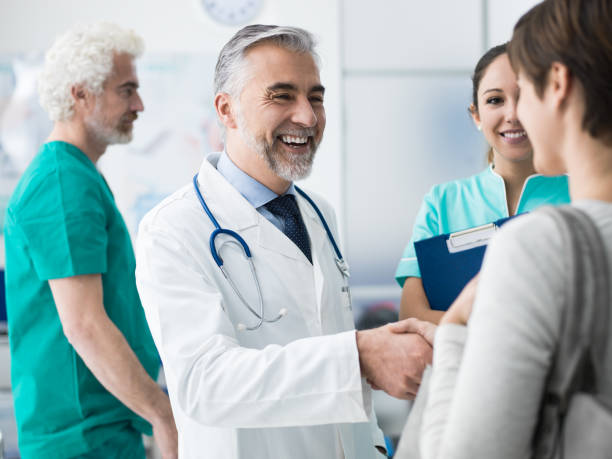 istock Confident doctor shaking patient's hand 891530996