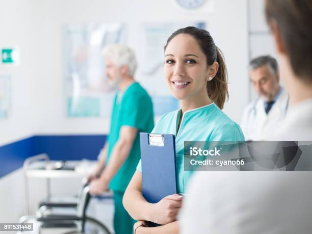 Young Nurse Working At The Hospital Stock Photo - Download Image Now - Nurse, Assistance, Hospital