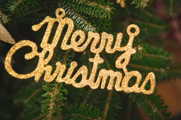 istock Merry christmas gold gleaming inscription 891531634