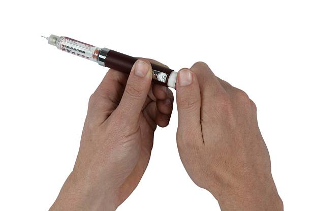 istock Winding up dose of insulin 89153165