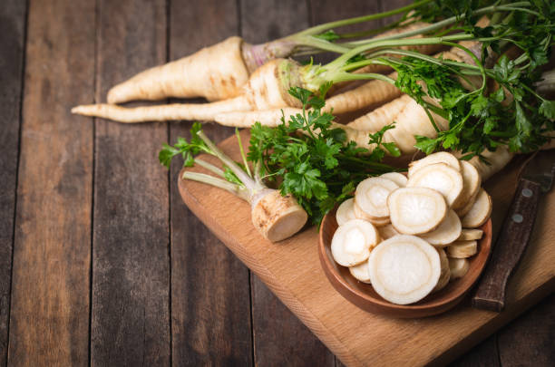 istock Fresh parsley root on the wooden table 891531988