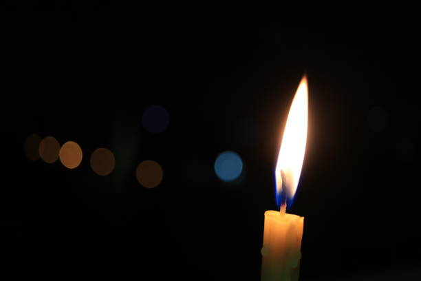 istock Fire and light from burning candle movement in darkness and bokeh background, hope, hopeless, guile, energy, classic, Life, End, Age, Time 891536870