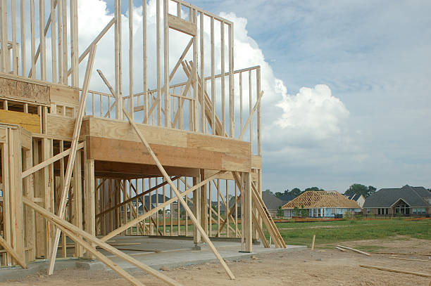 istock New Home Construction Showing Partially Framed House Others In Background 89153695