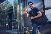 Man with bicycle in city