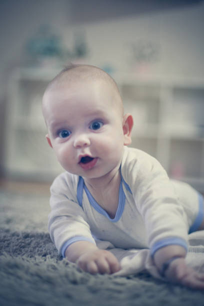 istock Cute baby boy portrait. On the move. 891537738
