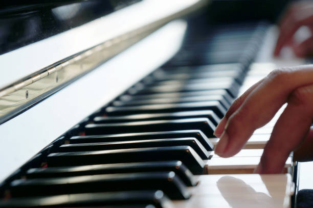 istock Male hands playing on the piano 891539986