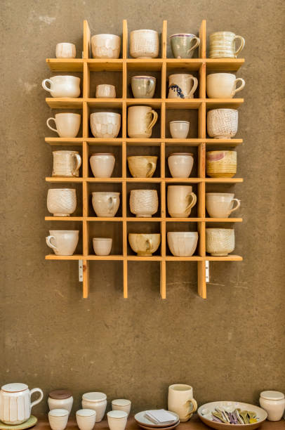 istock Ceramic cup on wooden shelves 891543900