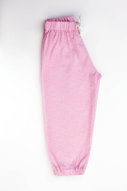 istock Pink nightwear pants on white 891544950