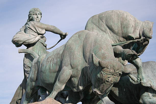 Beautiful bonze sculture heading the Gefion fountain in Copenhagen habour, close to the little mermaid. According to the myth, Gefion used oxen to plough the danish island of Zealand out of Sweden leaving the great swedish lake Vänern. Made by Anders Bundgaard and inaugurated 1908.