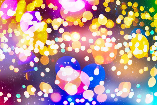 istock background with natural bokeh defocused sparkling lights. Colorful metallic texture with twinkling lights. Bright and vivid colors 891549984