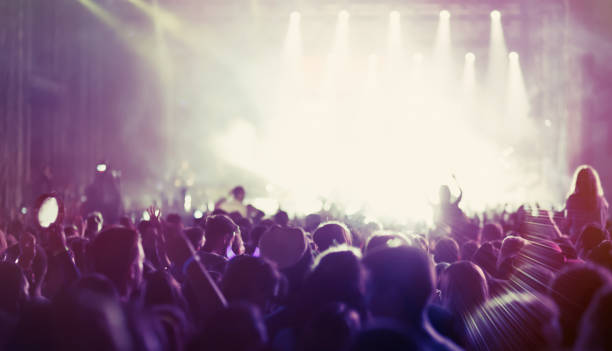 istock People dancing and cheering at festival 891550018