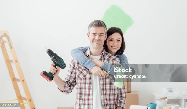 Couple Doing Home Renovations Stock Photo - Download Image Now - DIY, Painting - Activity, Renovation