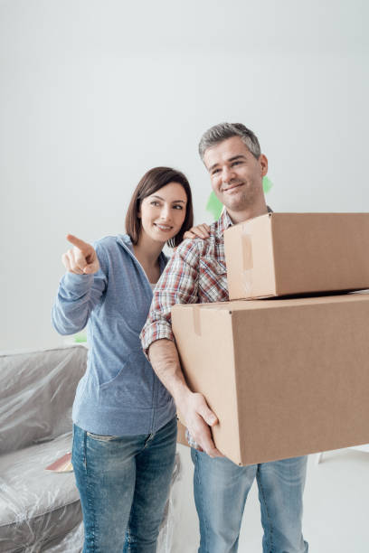 istock Couple moving into a new house 891550296