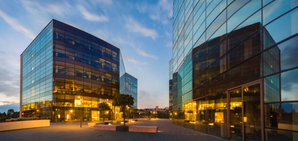 istock Modern office building in the evening 891550368
