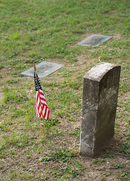 istock Tombstone and US Flag 89155851
