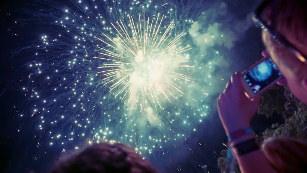 istock Woman enjoying fireworks celebration 891559478