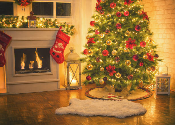istock Christmas Tree Near Fireplace at Home 891559480