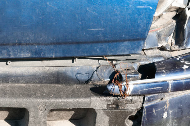 istock Broken rear light and bumper in crash accident on damaged blue car with dented sheet selective focus 891559896