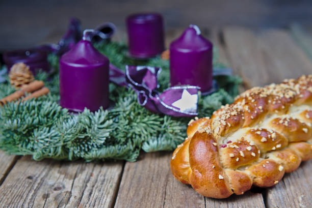 Homemade Czech Christmas cake with an advent wreath on a wooden table