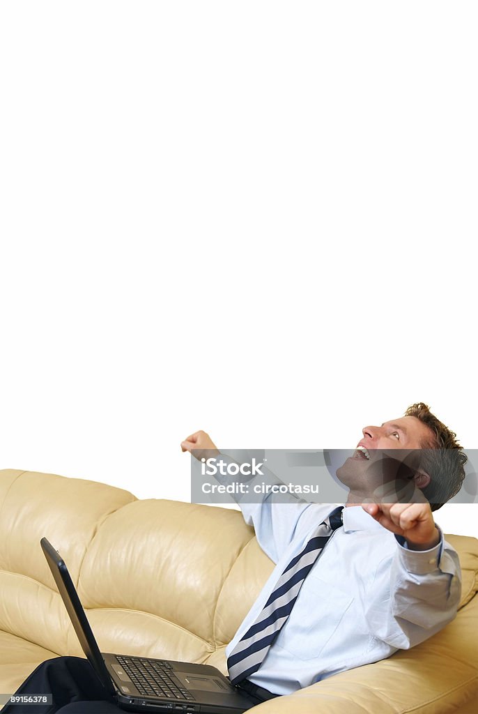 Young businessman with laptop enjoying a success  Adult Stock Photo