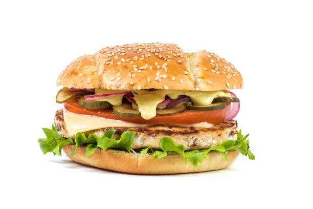 istock Fast food Burger with salad isolated against white background 891569860