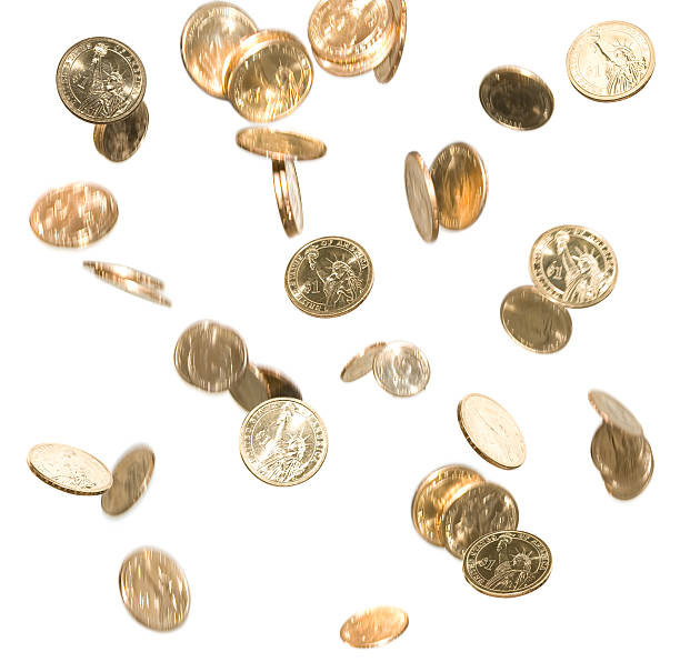 Falling Gold Dollar Coins Money in Motion Isolated on White stock photo