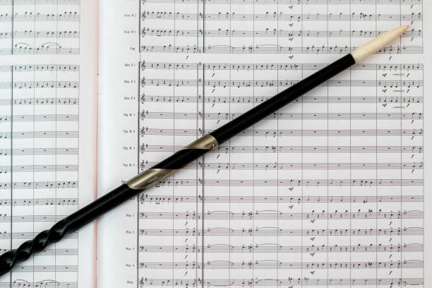 istock Score and baton of the conductor 891573156