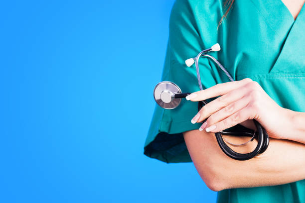 istock Female Doctor holding a stetoschope in her hands 891579194