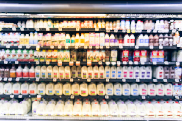 istock Blurred selection of dairy products in open front cold fridge 891586160