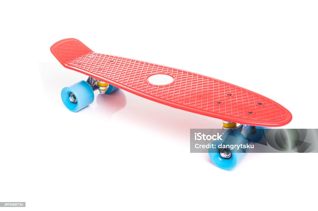 Red plastic skateboard on white background Red plastic skateboard isolated on white background Skateboard Stock Photo