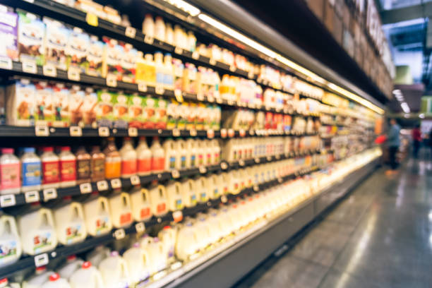 istock Blurred selection of dairy products in open front cold fridge 891588826