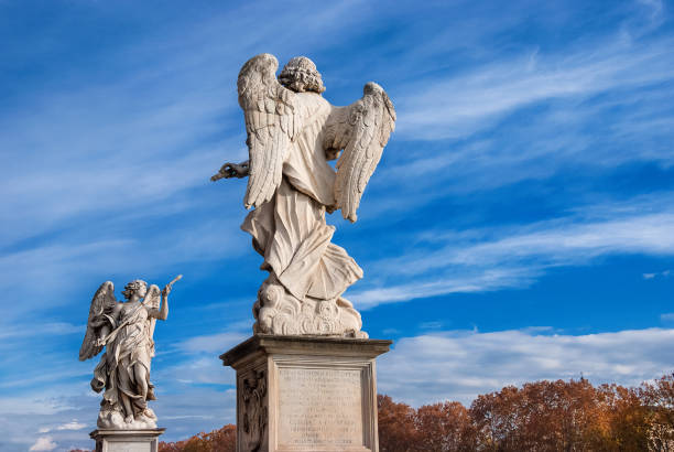 istock Holy Angel Bridge statues with autumn sky 891596616