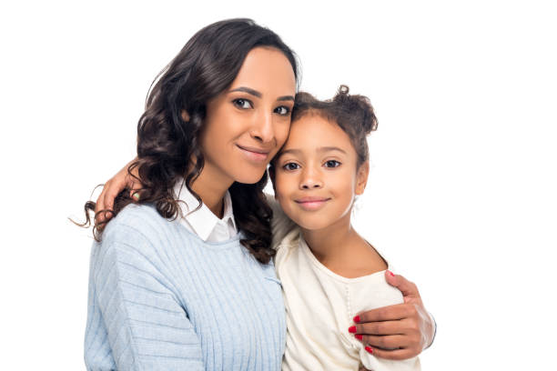 african american mother and daughter beautiful happy african american mother and daughter smiling at camera isolated on white the black womens expo stock pictures, royalty-free photos & images