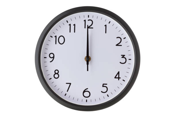Round office wall clock on white, midnight or midday stock photo