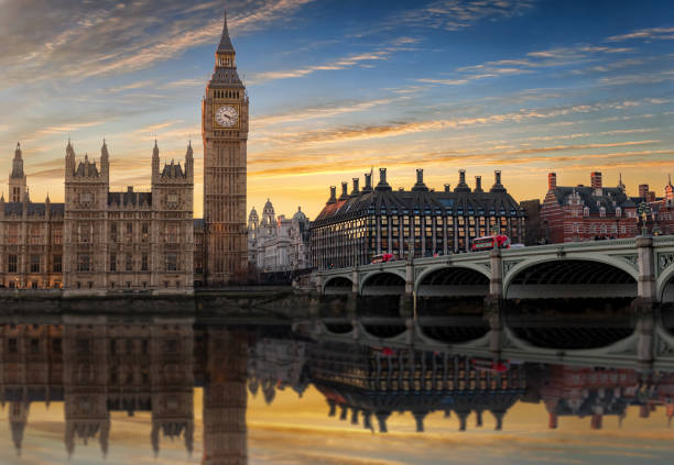 istock Westminster and Big Ben with reflections in the Thames river 891597264